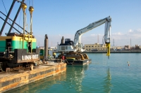 Atlas Copco hydraulic breaker used in port development in Italy